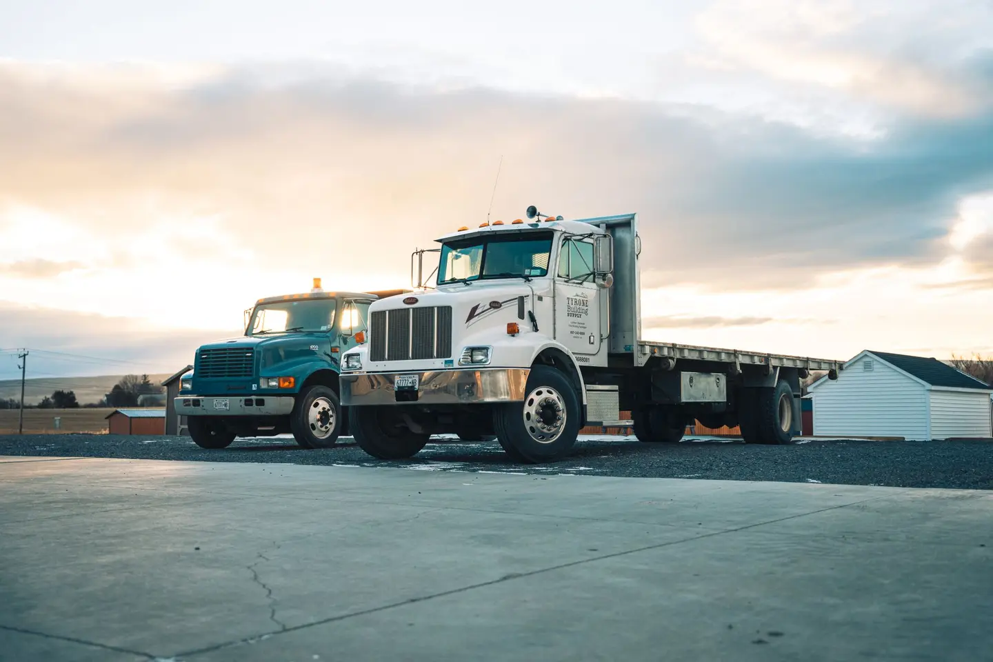 Tyrone Building Supply delivery trucks parked at the lumber yard