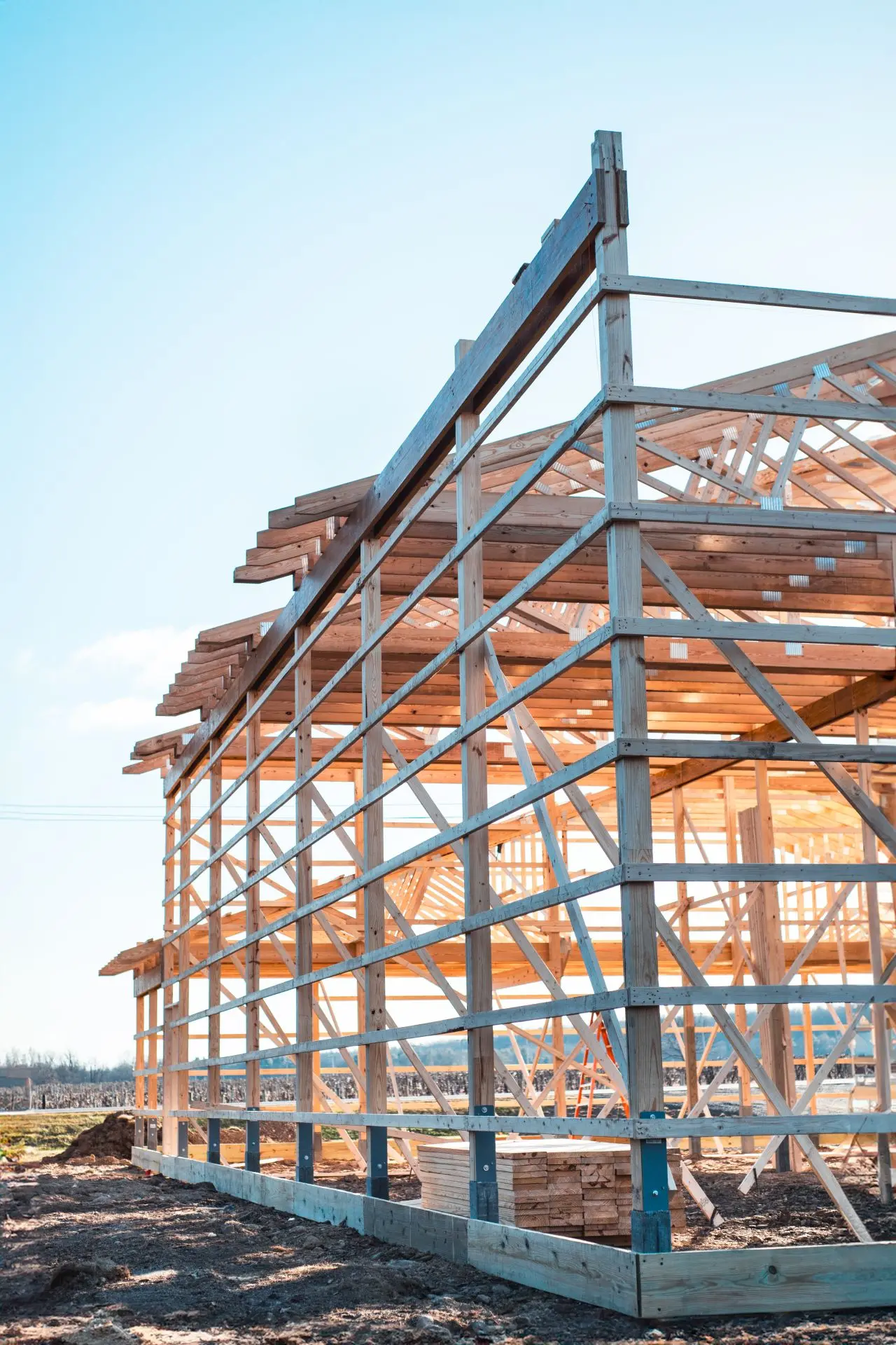 Pole barn timber frame and roof trusses under construction
