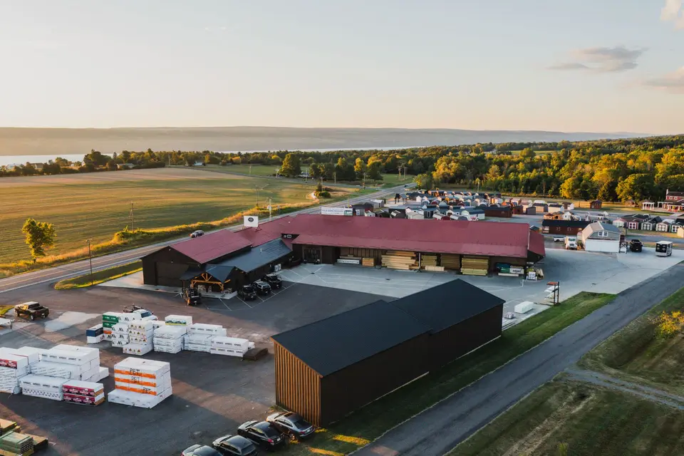 Aerial view of lumber storage buildings and packaged materials at the yard